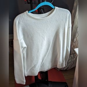 Oversized white sweater with side zipper detailing